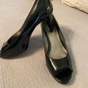 Black patent leather open toe 2.5 inch heels.